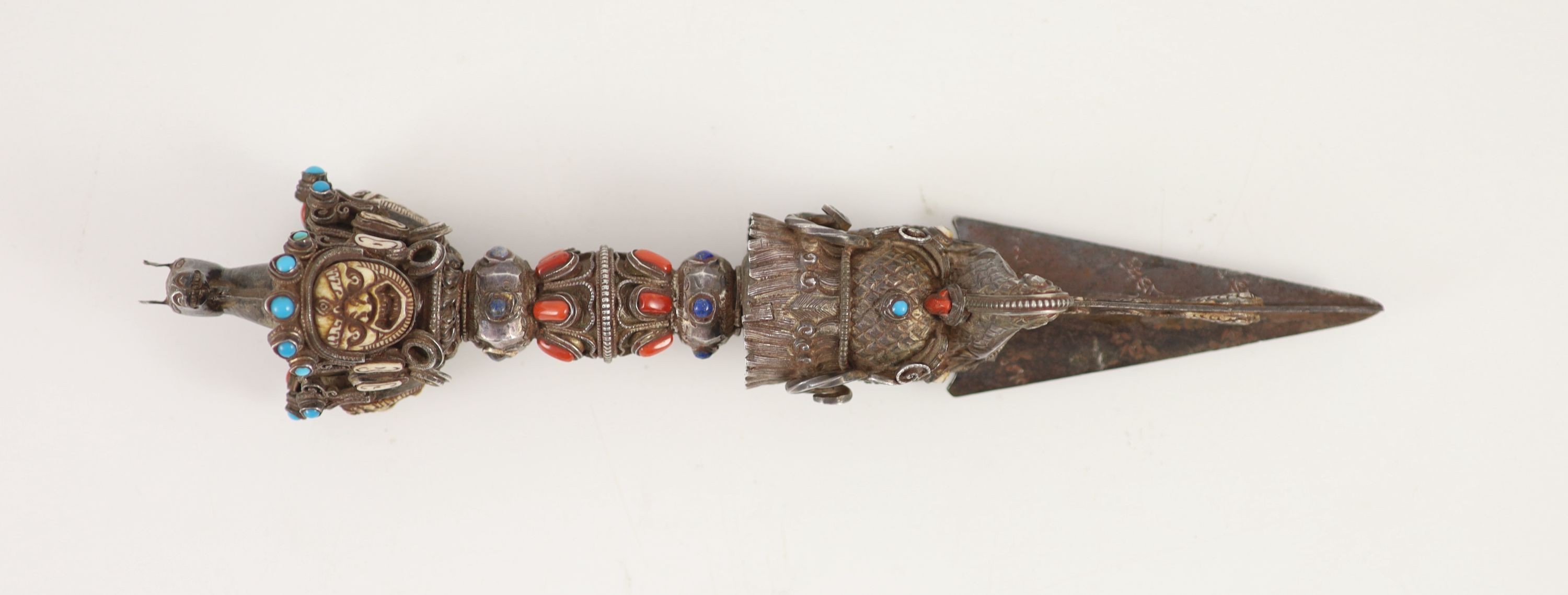 A Tibetan silver, bone and gem set phurbu (ritual dagger), 19th/20th century, 27.5 cm long, some of the stones replaced with glass